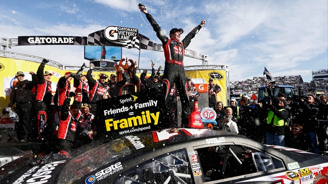 Kurt Busch celebrates after winning the NASCAR Sprint Cup Series STP 500 at Martinsville Speedway, Virginia