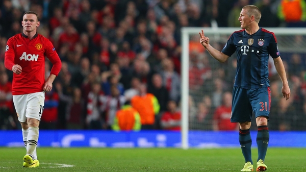 Bastian Schweinsteiger makes his views clear to Wayne Rooney after he received a red card during the Champions League Quarter-final first leg