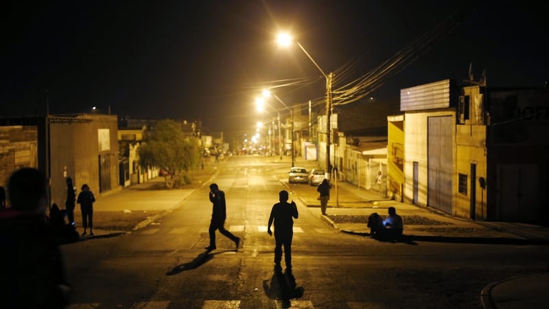 A group of people during an evacuation towards higher zones in the city of Iquique, Northern Chile (Pic: EPA)