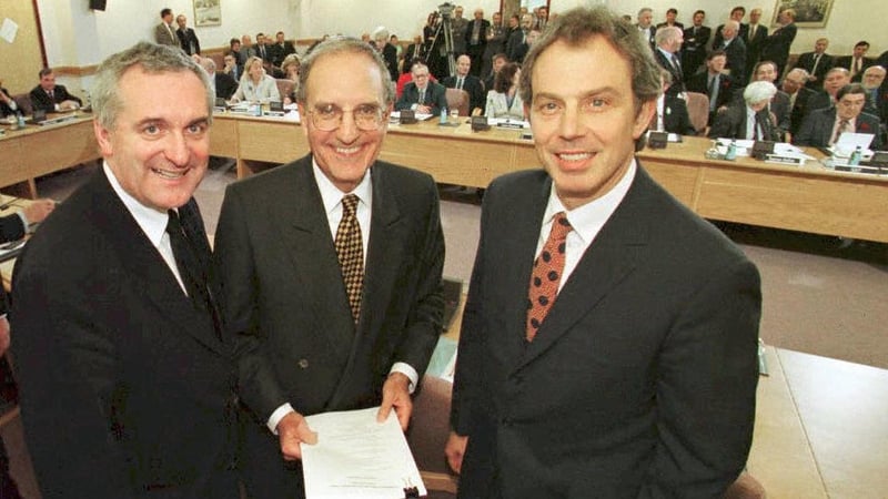Bertie Ahern, George Mitchell and Tony Blair on 10 April 1998, after signing the Good Friday Agreement