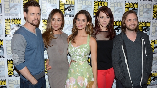 Aaron Stanford (right) with Nikita co-stars at the 2012 Comic-Con
