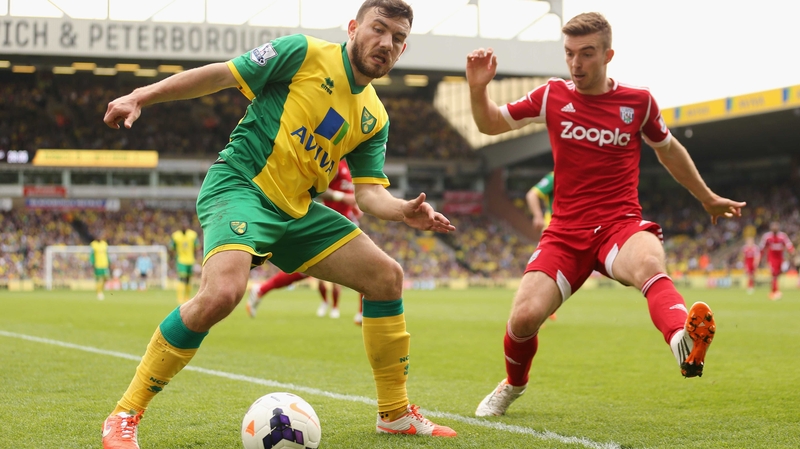 James Morrison (R) of West Brom closes down Norwich's Robert Snodgrass