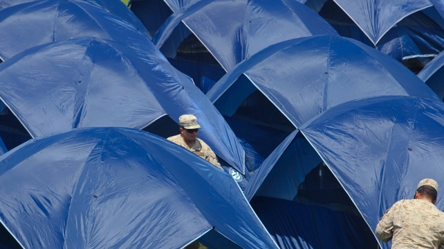 View of tents for families camping on the Carlos Dittborn stadium in Arica, 2050 km north of Santiago on April 5, 2014 in fear their homes might collapse. Life was gradually returning to normal in quake-hit Chile officials said on the eve, with power rest