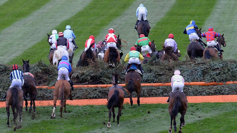 Runners and Riders jump Valentine's during the Crabbie's Grand National Steeple Chase at Aintree Racecourse in Liverpool, England