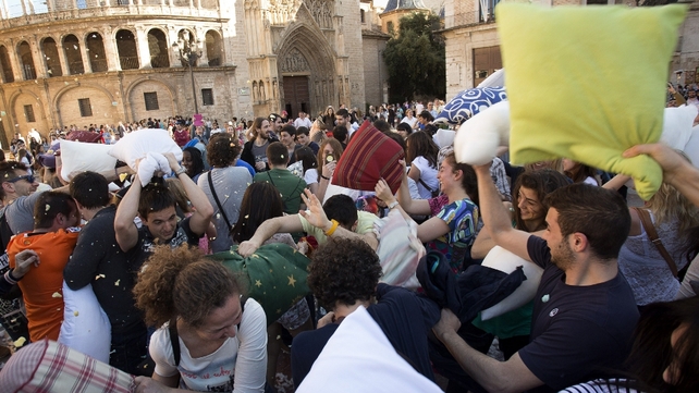 People hit each other with pillows during an event dubbed International Pillow Fight Day in Valencia as part of the event created in 2008