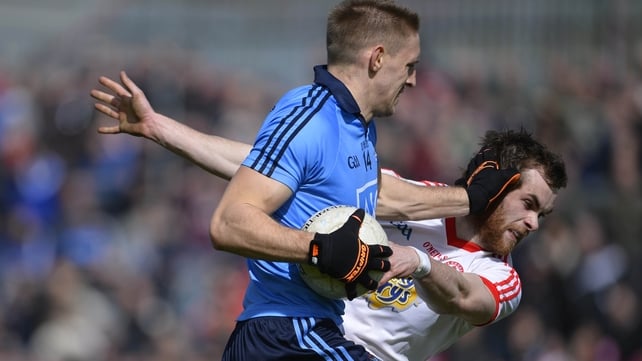 Dublin's Eoghan O'Gara fends off the challenge of Ronan McNamee of Tyrone