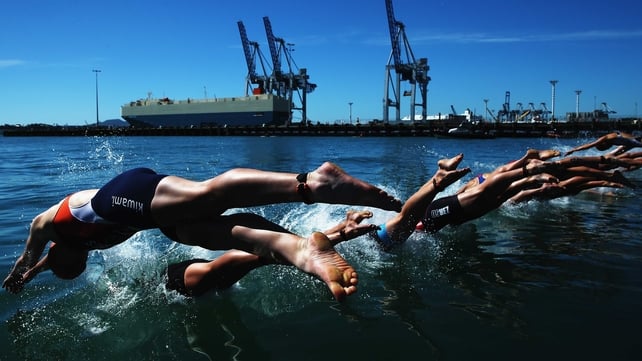 Competitors dive during the ITU World Triathlon elite women's race in Auckland, New Zealand