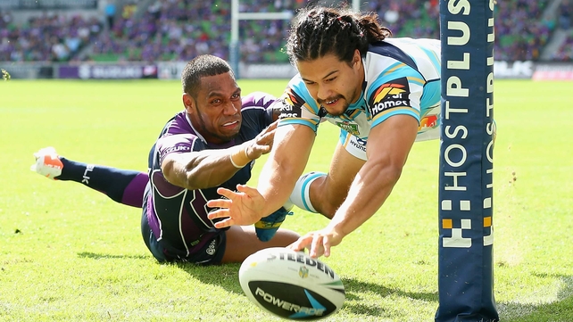 Kevin Gordon of the Titans scores a try against the Melbourne Storm at AAMI Park