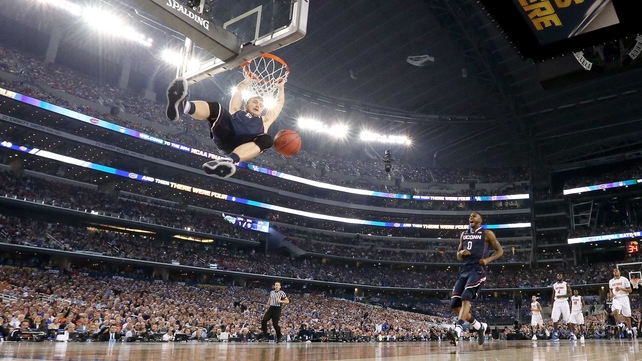 Niels Giffey of the Connecticut Huskies dunks against the Florida Gators in Arlington, Texas