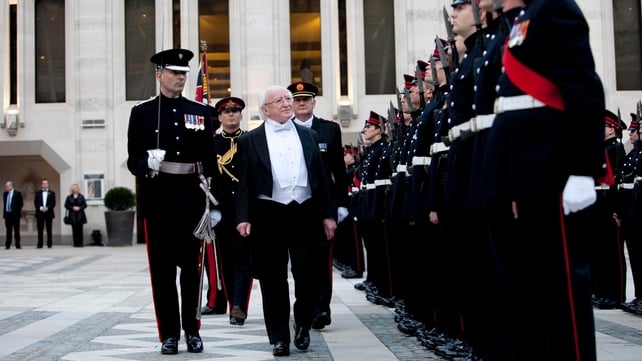 President Higgins inspects a guard of honour ahead of the gala dinner
