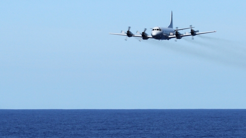 A Royal Australian Air Force plane conducts a low-level fly in the search for Flight MH370