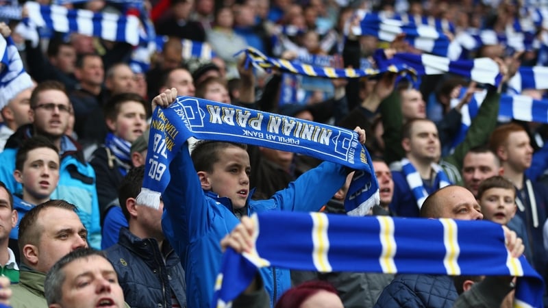Cardiff fans show their allegance to the old team colours by waving blue and white scarves during their clash with Crystal Palace