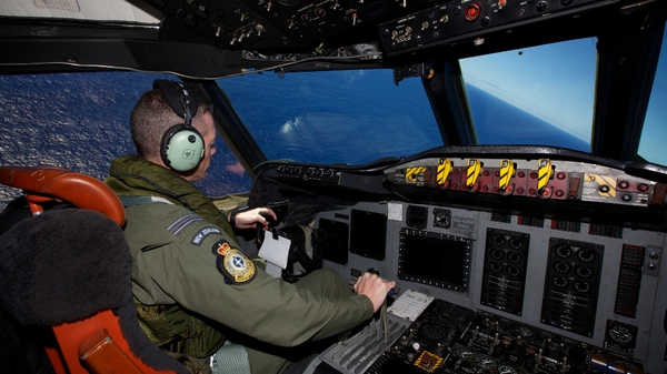 Tim McAlevey of the Royal New Zealand Air Force flying a P-3 Orion during a search to locate missing Malaysia Airways Flight MH370