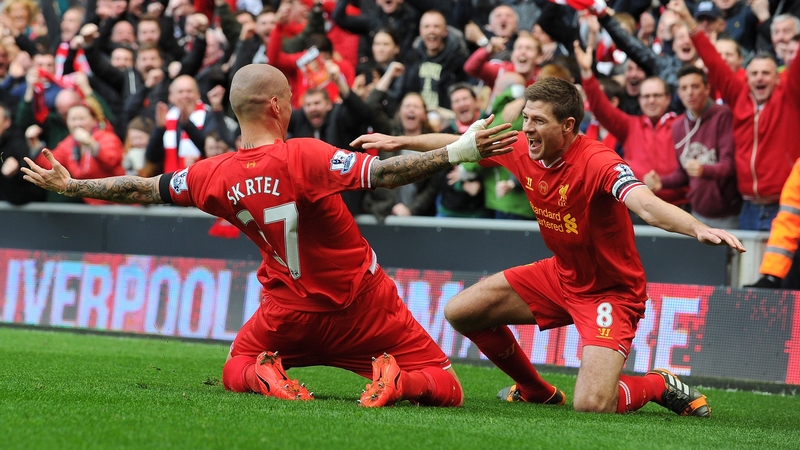 Martin Skrtel celebrates with Steven Gerrard after scoring Liverpool's second goal