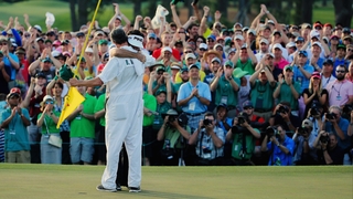 Bubba Watson celebrates the victory with his caddie