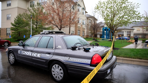 Police cars outside Village Shalom, the senior living centre where one of three victims was killed