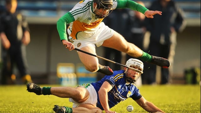 Offaly's Dan Currams and Darragh O'Connell of Kerry tussle for possession at Semple Stadium