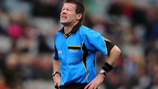 Referee Padraig Hughes feels the exertion during Derry's clash with Mayo at Croke Park