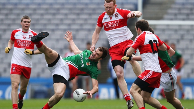 Derry's Fergal Doherty and Jason Gibbons of Mayo in action
