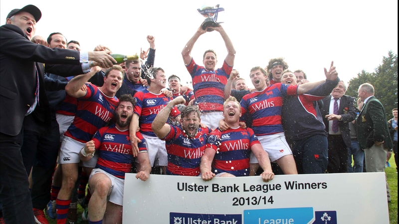 Clontarf players celebrate with the league trophy at Castle Avenue