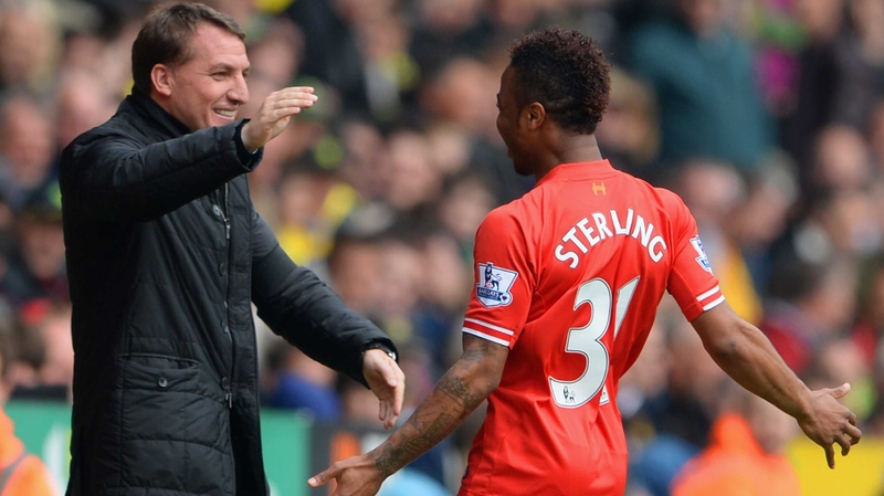 Raheem Sterling celebrates scoring the opening goal with Liverpool manager Brendan Rodgers