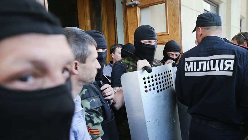 Pro-Russian activists break through the gate in front of TRK Donbass television station in Donetsk