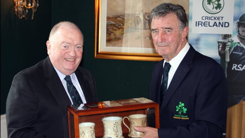 Joe Doherty receives the ceremonial Staffordshire Mugs from outgoing president Robin Walsh