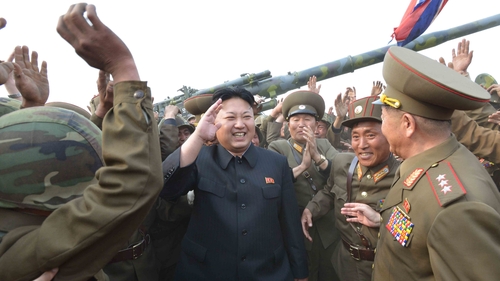 North Korean leader Kim Jong-un, seen in an undated photo, meets soldiers of a long-range artillery unit
