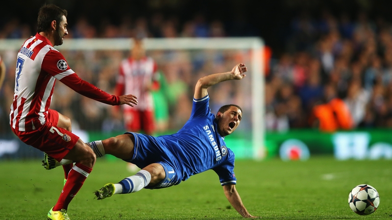 Eden Hazard is tackled by Adrian Lopez