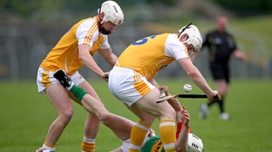 Carlow's James Doyle struggles under the attention of Neal McAuley and Aaron Graffin of Antrim