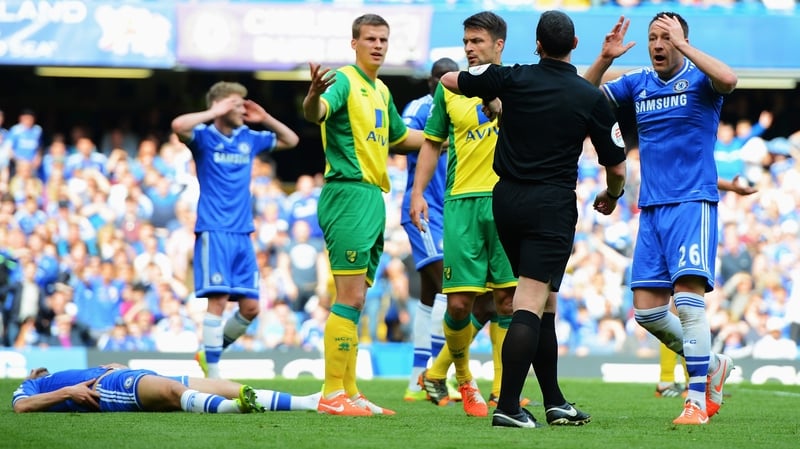 John Terry protests to referee Neil Swarbrick after Chelsea are denied a penalty