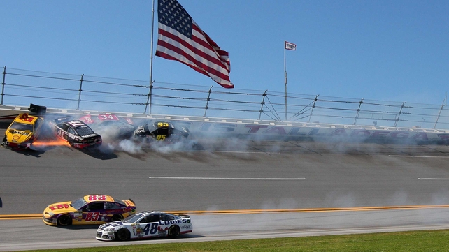 Competitors crash during the NASCAR Sprint Cup Series at Talladega Superspeedway