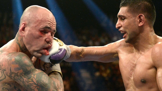 Amir Khan connects with a right on Luis Collazo during their welterweight bout in Las Vegas, Nevada