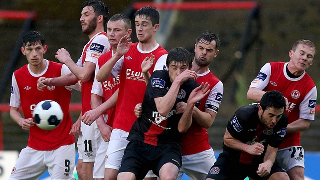 St Patrick's Athletic and Bohemians players face a free kick during their League Cup encounter at Dalymount