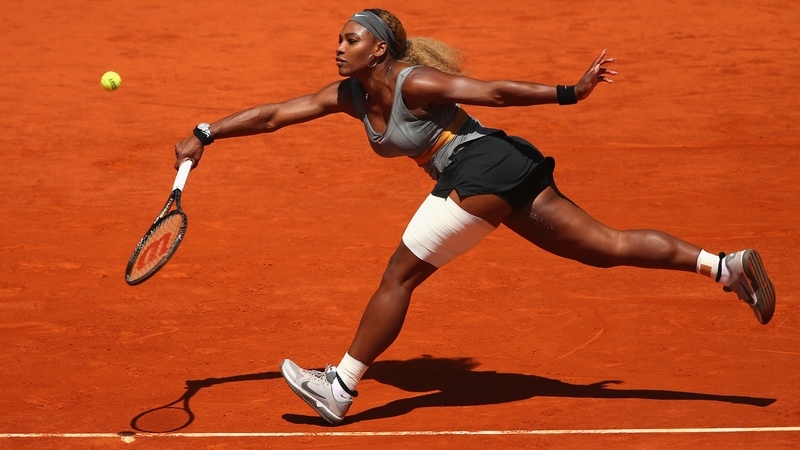 Serena Williams stretches to play a forehand against Carla Suarez Navarro in the third round of the Madrid Open