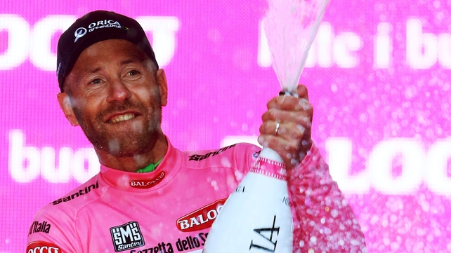 Svein Tuft celebrates after Orica GreenEDGE won the Team Time Trial and he won the maglia rosa