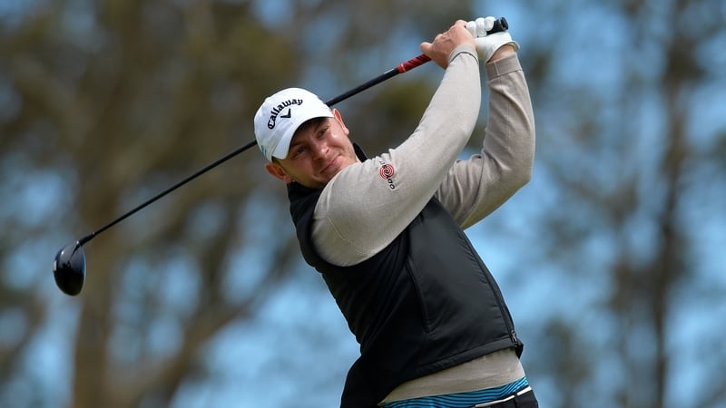 Scott Henry plays his tee shot at the 16th