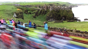 Giro d'Italia riders traveling past Dunluce Castle