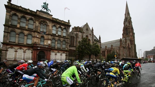 The peloton makes it's way past Orange Hall and Carlisle memorial church on Clifton Street in Belfast.