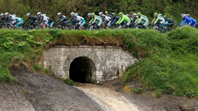 The Giro d'Italia riders pass along the Antrim coast on Saturday