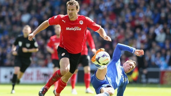 Fernando Torres is challenged by Ben Turner