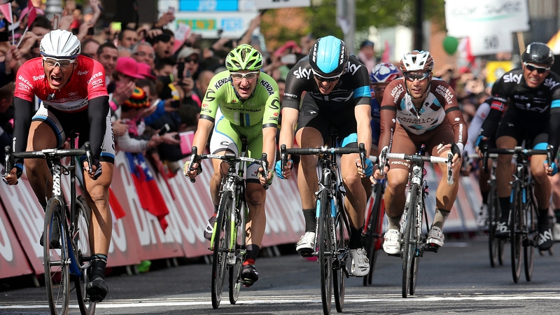 Giant-Shimano's Marcel Kittel (left red jersey) comes home to win stage three