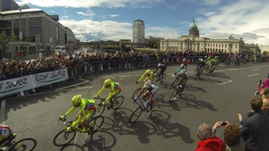 The Peloton travels across Matt Talbot Bridge in Dublin during stage three of the Giro D'Italia