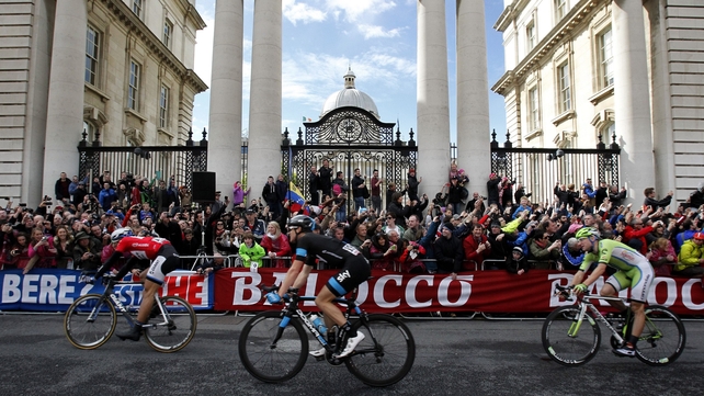 Giant-Shimano's Marcel Kittel (left) passes Government Buildings on Merrion Street after crossing the finish line to win stage three of the 2014 Giro d'Italia on Sunday