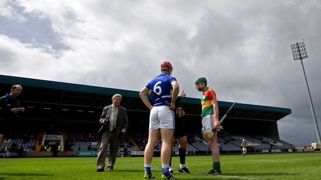 The Laois and Carlow captains look on as the ref tosses the coin ahead of their Leinster SHC clash