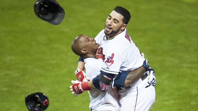 Nyjer Morgan and Mike Aviles of the Cleveland Indians celebrate after Aviles hits a walk-off single to defeat the Minnesota Twins
