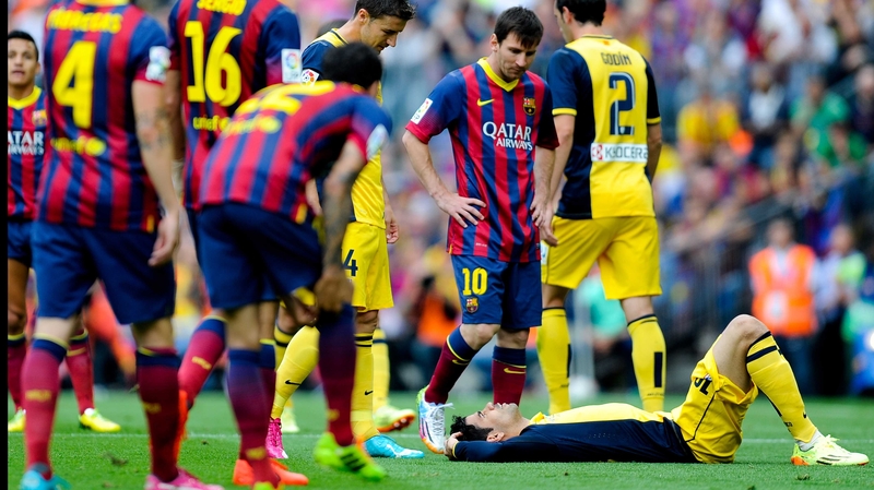 Diego Costa lies injured against Barcelona
