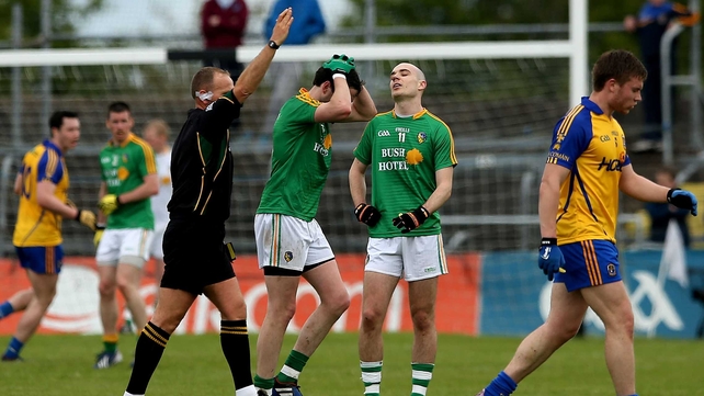 Referee Conor Lane shows a black card to Leitrim's Darren Sweeney during their clash with Roscommon in Dr Hyde Park