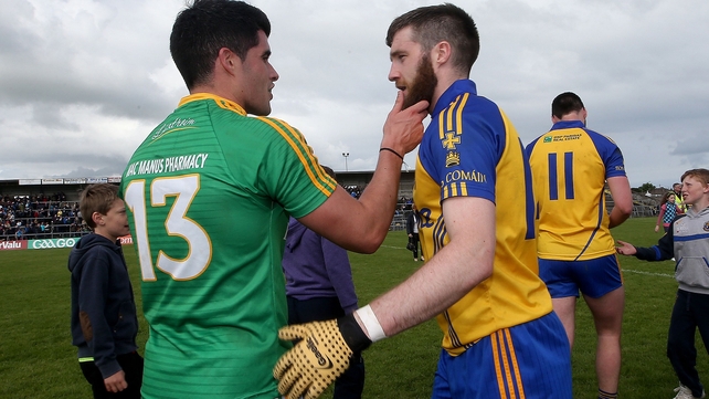 Leitrim's Emlyn Mulligan talks with Cathal Cregg of Roscommon about his facial hair