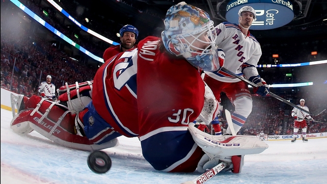 Peter Budaj of the Montreal Canadiens is unable to stop a goal by the New York Rangers in the Eastern Conference Finals of the NHL Stanley Cup in Montreal, Canada